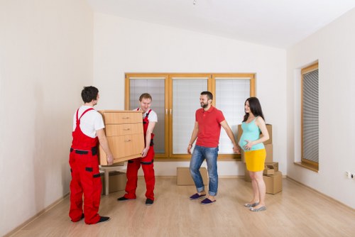 Man with van loading household furniture for a local removal in Tobelgium