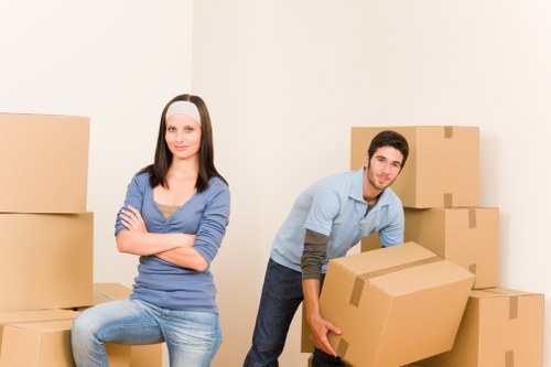 Packed moving boxes and furniture secured inside a removal van