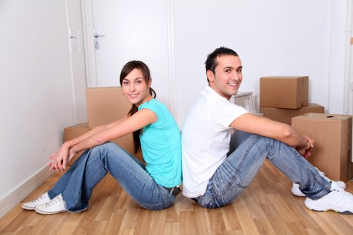 Professional movers loading furniture for a Tobelgium move