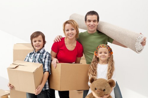 House moving crew handling stairs and bulky items in Tobelgium