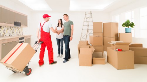 Moving team coordinating loading and transport for a Tobelgium house relocation