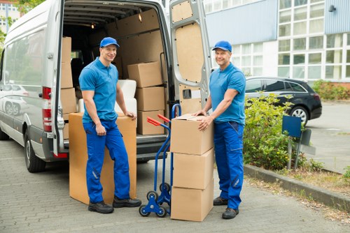 Residential move with furniture being carried from a Tobelgium property